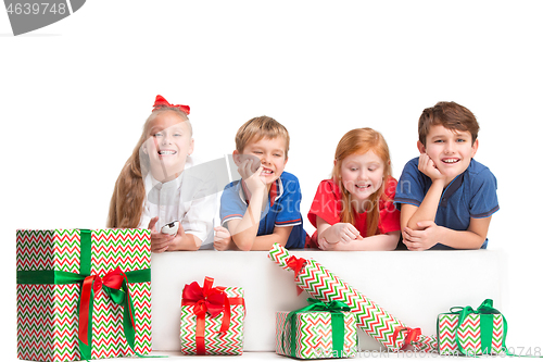 Image of Full length portrait of cute little kids in stylish clothes looking at camera and smiling