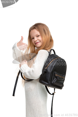 Image of Full length portrait of cute little kid in stylish jeans clothes looking at camera and smiling