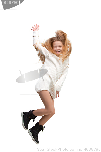Image of Cute little girl jump. Studio shot. White background