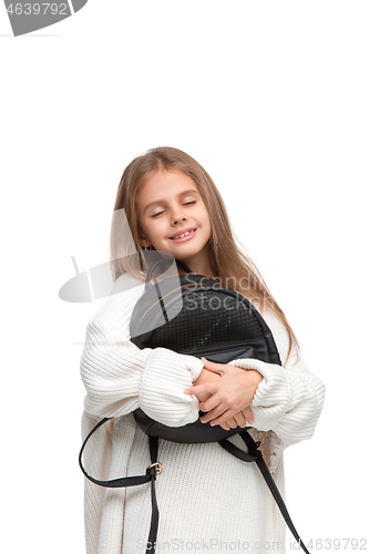 Image of Full length portrait of cute little kid in stylish jeans clothes looking at camera and smiling