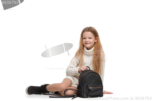 Image of Full length portrait of cute little kid in stylish jeans clothes looking at camera and smiling