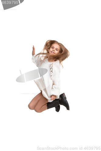 Image of Cute little girl jump. Studio shot. White background