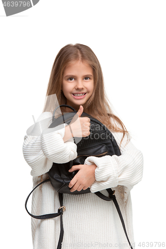Image of Full length portrait of cute little kid in stylish jeans clothes looking at camera and smiling