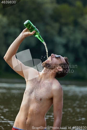 Image of Man drinking like crazy