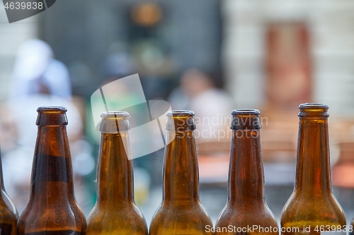 Image of Beer bottles at a pub terrace