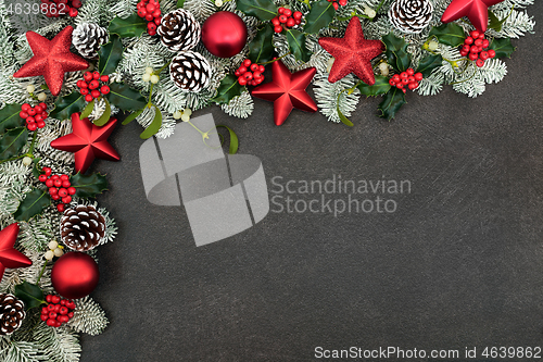 Image of Christmas Border with Red Star Baubles and Winter Greenery