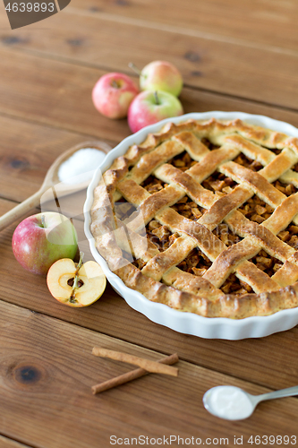 Image of close up of apple pie on wooden table