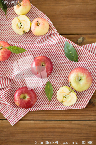 Image of ripe red apples on wooden table