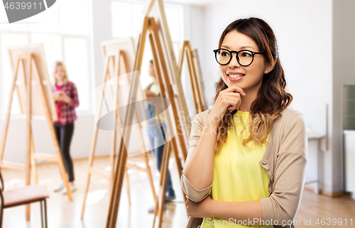 Image of happy asian woman in glasses or student