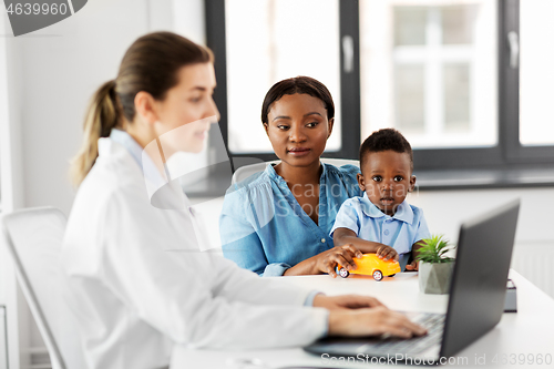 Image of mother with baby son and doctor at clinic