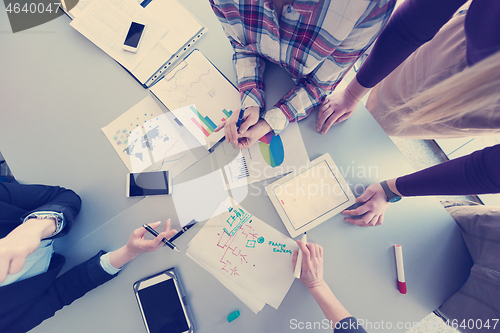 Image of top  view of business people group brainstorming on meeting