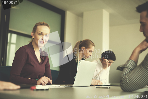 Image of young business people group on team meeting at modern office