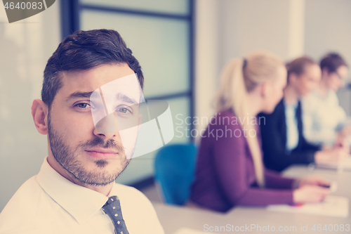 Image of young business people group on team meeting at modern office