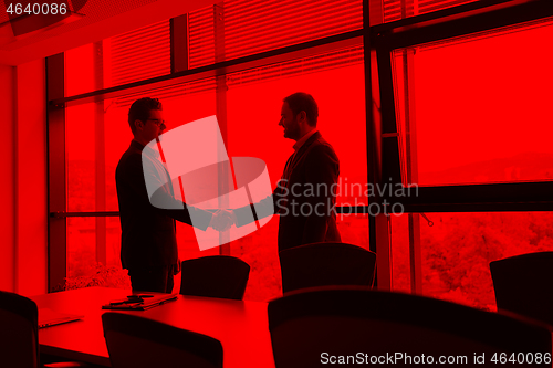 Image of cloasing the deal in modern office interior