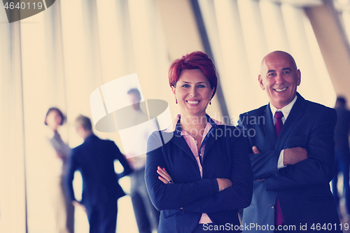 Image of diverse business people group with redhair  woman in front