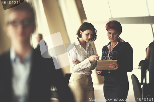 Image of business people group, woman in front  as team leader