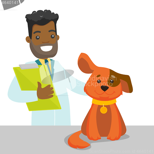 Image of African-american veterinarian examining dog.