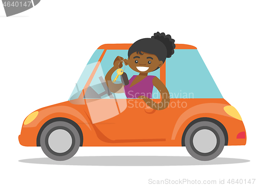 Image of African-american woman showing key to her new car.