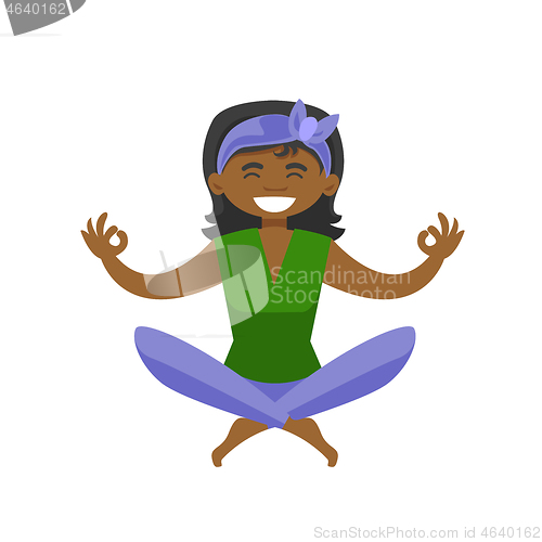 Image of African-american woman meditating in lotus pose.