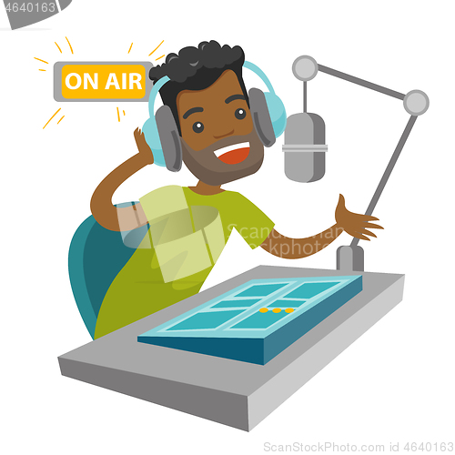Image of African radio host working at the radio studio.