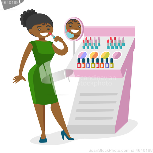 Image of Young african-american woman buying lipstick.