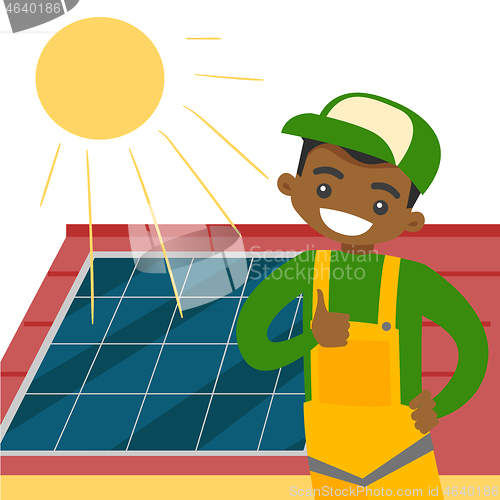 Image of Young african constructor installing solar panel