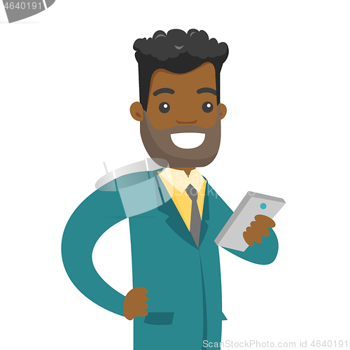 Image of Young businessman looking at mobile phone.