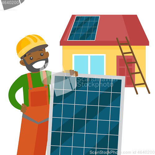 Image of Young african constructor installing solar panel.