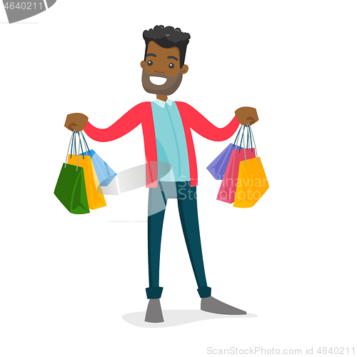 Image of African-american consumer holding shopping bags.