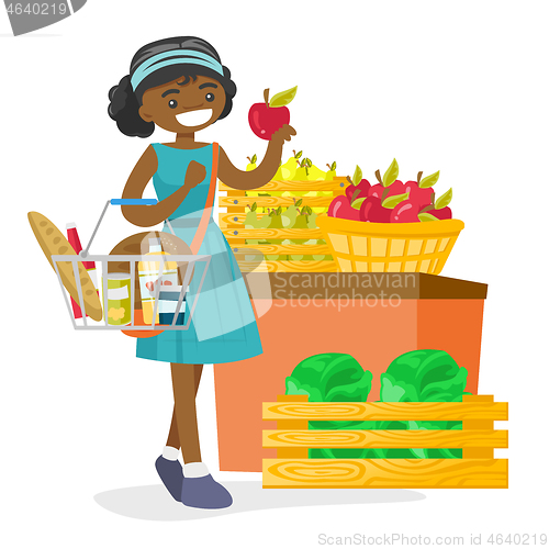 Image of Young african-american woman buying products.