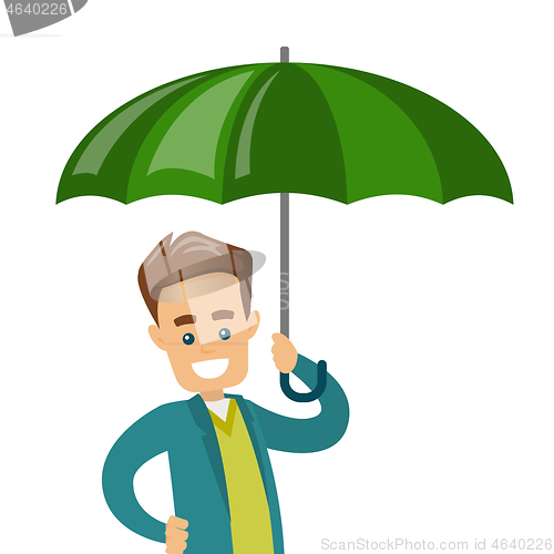 Image of Caucasian insurance agent standing under umbrella.