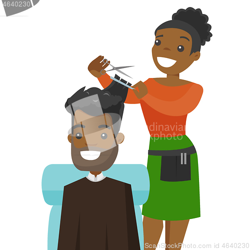 Image of Hairdresser making a haircut to a young man.