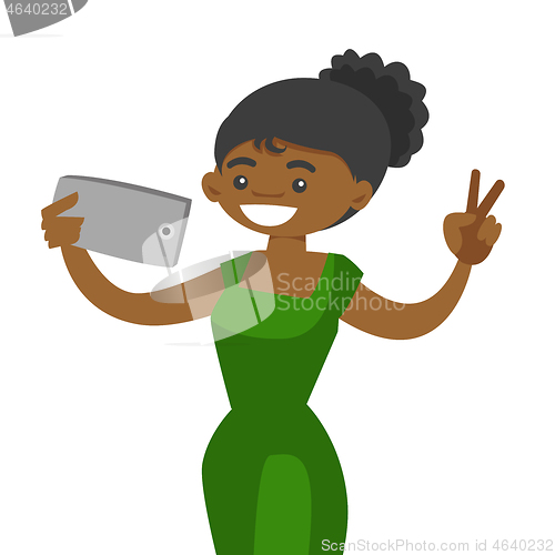 Image of Young african woman making selfie with a cellphone