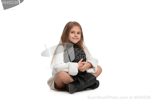 Image of Full length portrait of cute little kid in stylish jeans clothes looking at camera and smiling