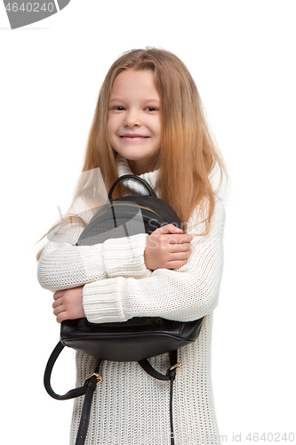Image of Full length portrait of cute little kid in stylish jeans clothes looking at camera and smiling