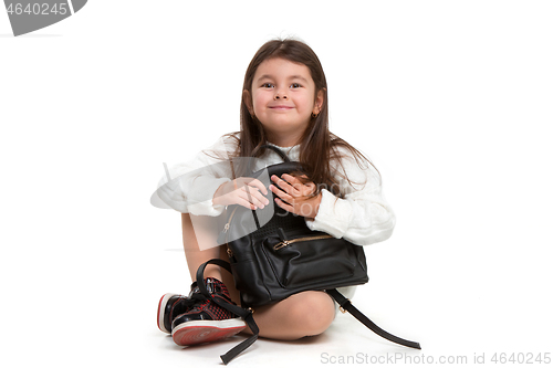 Image of portrait of cute little kid in stylish jeans clothes looking at camera and smiling