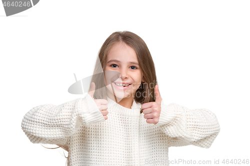 Image of portrait of cute little kid in stylish knitted, sweater looking at camera and smiling