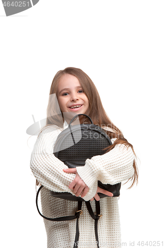 Image of portrait of cute little kid in stylish jeans clothes looking at camera and smiling