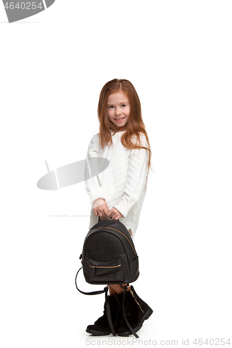 Image of Full length portrait of cute little kid in stylish jeans clothes looking at camera and smiling