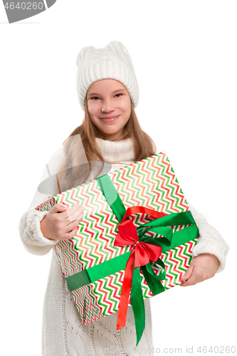 Image of Full length portrait of cute little kid in stylish knitted sweater looking at camera and smiling