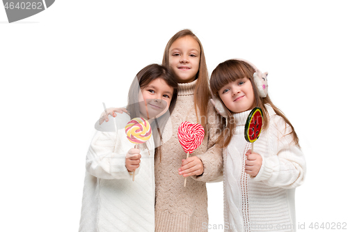 Image of portrait of cute little kids in stylish clothes looking at camera and smiling