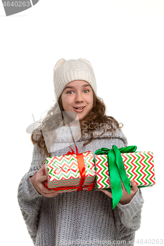 Image of Full length portrait of cute little kid in stylish knitted sweater looking at camera and smiling