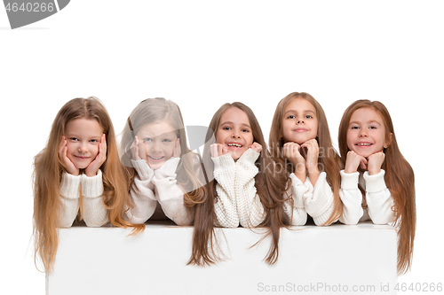 Image of portrait of cute little kids in stylish clothes looking at camera and smiling