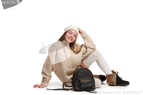 Image of Full length portrait of cute little kid in stylish jeans clothes looking at camera and smiling