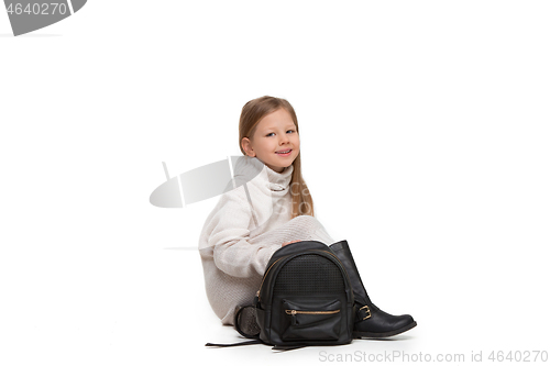 Image of Full length portrait of cute little kid in stylish jeans clothes looking at camera and smiling