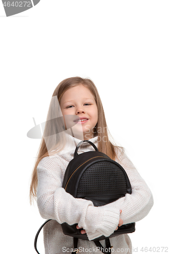 Image of portrait of cute little kid in stylish jeans clothes looking at camera and smiling