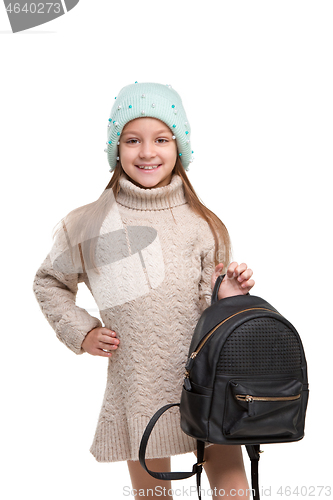 Image of portrait of cute little kid in stylish jeans clothes looking at camera and smiling