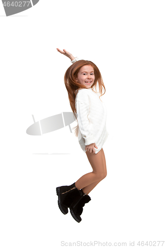 Image of Cute little girl jump. Studio shot. White background