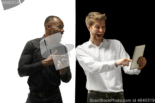 Image of success happy afro and caucasian men. Mixed couple. Human facial emotions concept.