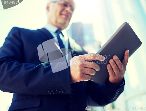 Image of businessman with tablet pc outdoors